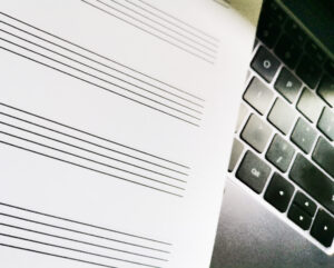 A manuscript paper on the laptop's keyboard